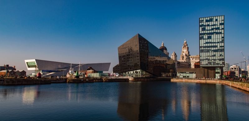 the albert dock o f liverpool, building with lake water reflection