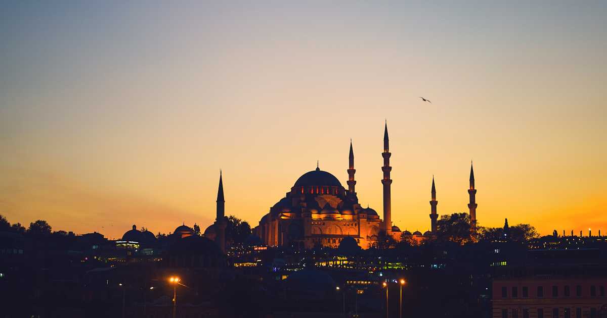 a mosque in susnset, blue mosque in yellow sky - Journey Inspirations a mosque in susnset, blue mosque in yellow sky