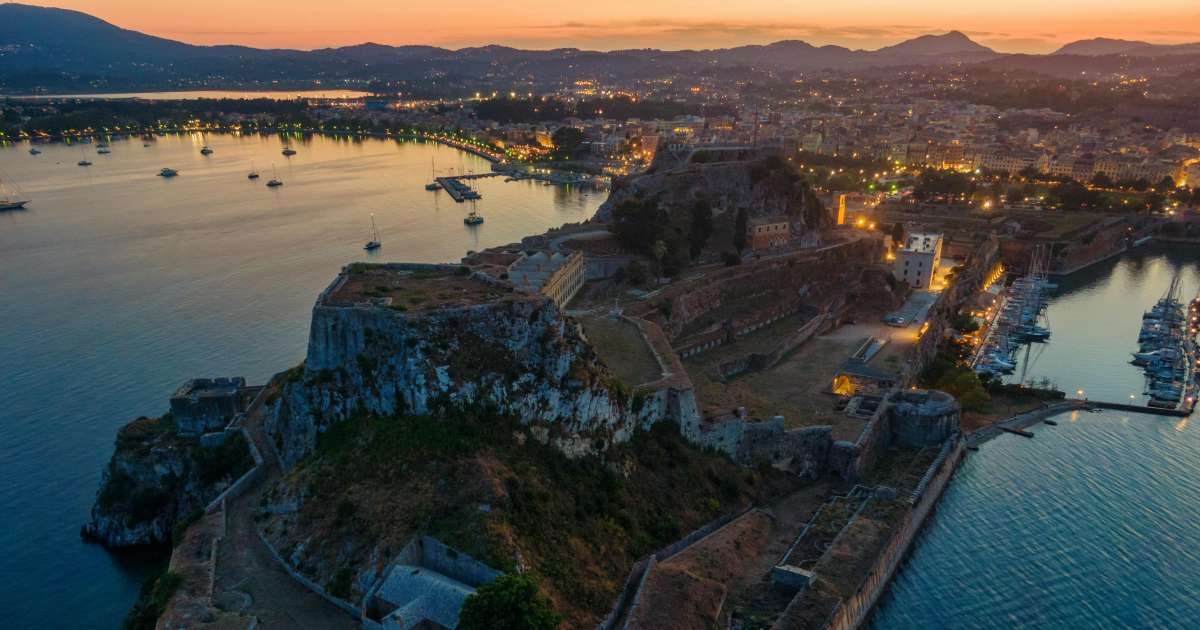 corfu town when the sun sets, beautiful beach and a castle