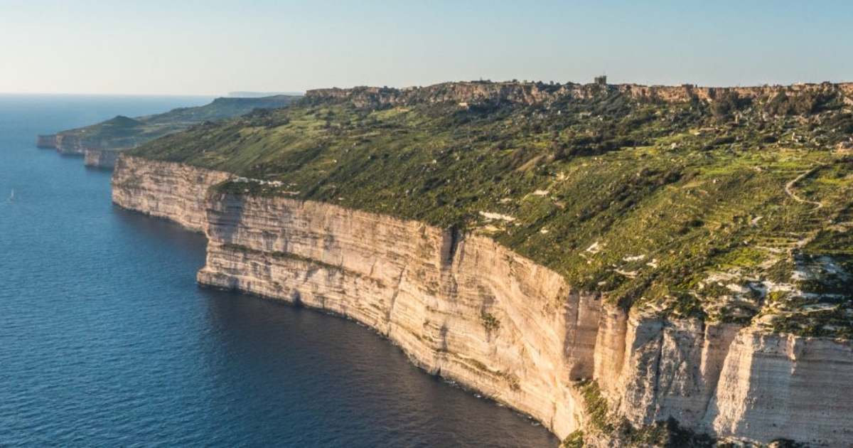 dingli cliffs - Journey Inspirations dingli cliffs in malta, cliffs above the beach with green trees