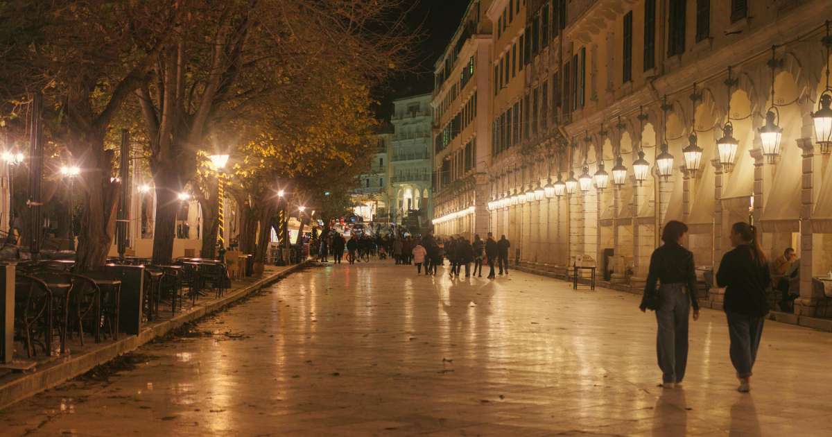 liston square, people walking during nighttime, trees and people