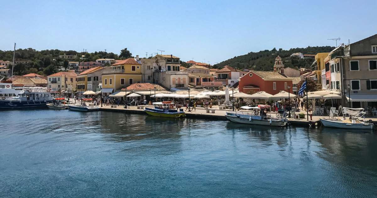 paxos town with small houses and taverns around the beach