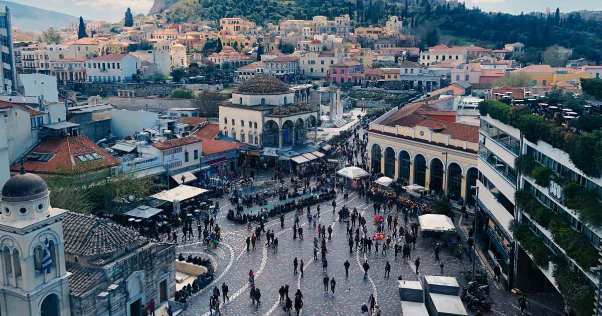 plaka - Journey Inspirations monastiraki square in athens from above, planty of people